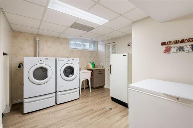 Laundry room with ample additional storage | Image 16