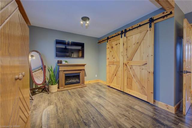 Main floor living room with bay window and access to upper deck | Image 6