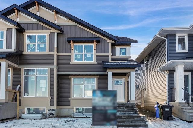 161 Ambleton Drive Nw, Home with 3 bedrooms, 2 bathrooms and 2 parking in Calgary AB | Image 3