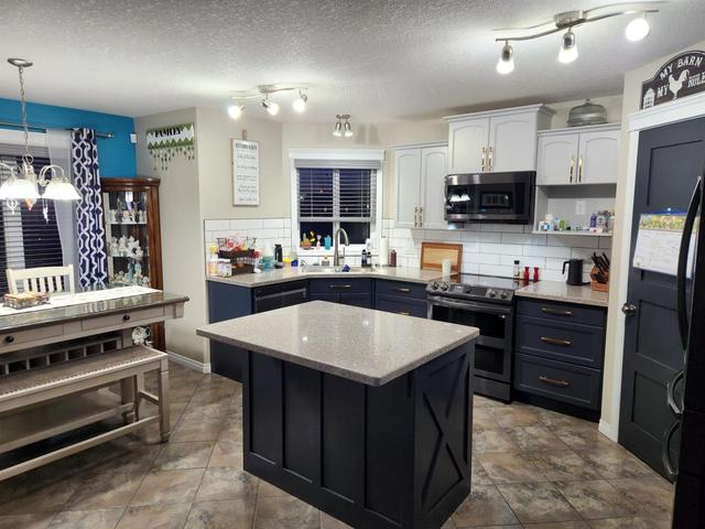 8917 131 Avenue, House detached with 4 bedrooms, 3 bathrooms and 6 parking in Grande Prairie AB | Image 4