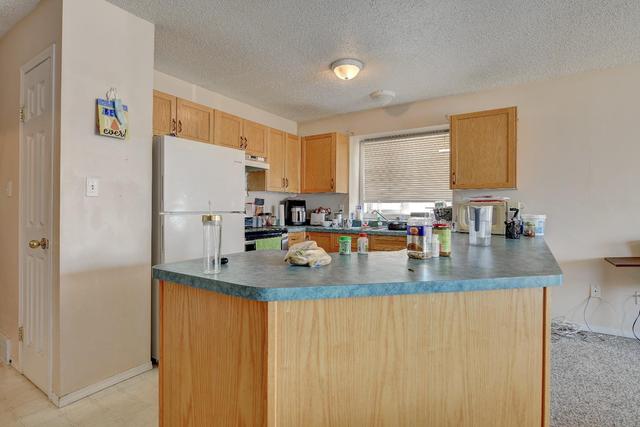 9214 94a Avenue, Home with 5 bedrooms, 3 bathrooms and 4 parking in Grande Prairie AB | Image 5