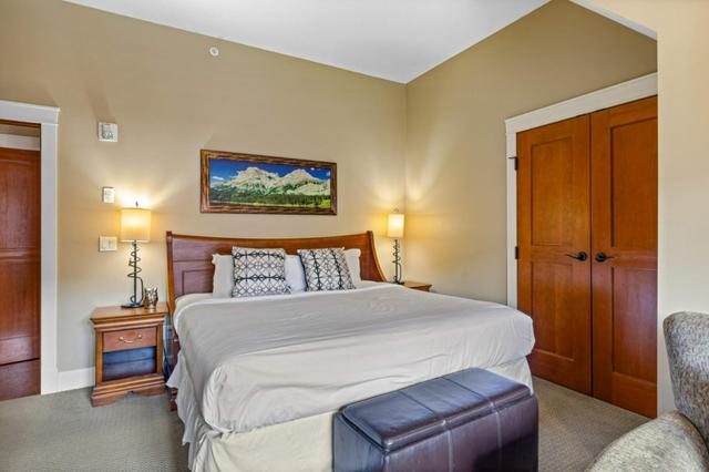 401 - 191 Kananaskis Way, Condo with 2 bedrooms, 2 bathrooms and 1 parking in Canmore AB | Image 25