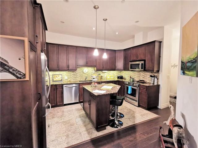 102 - 223 Erb Street W, House attached with 2 bedrooms, 2 bathrooms and 1 parking in Waterloo ON | Image 3