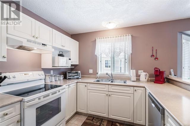 103 - 1150 Walkem Rd, House attached with 2 bedrooms, 2 bathrooms and 1 parking in Ladysmith BC | Image 12