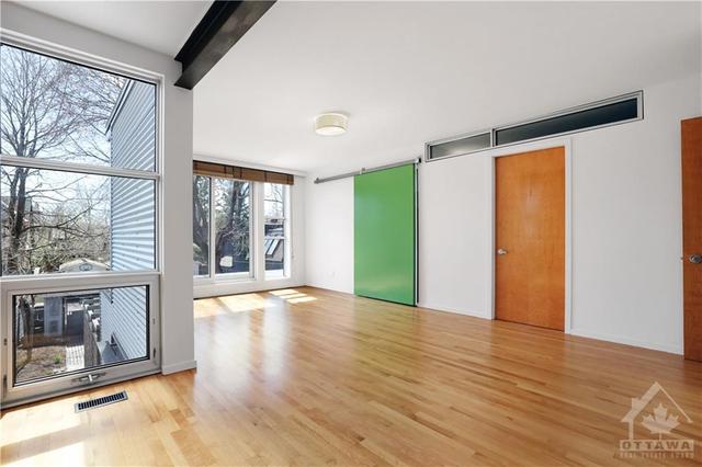 Loft door open to one of the walk in closets  transoms provide natural light to the en-suite bathroom. Sunfilled and private. | Image 19