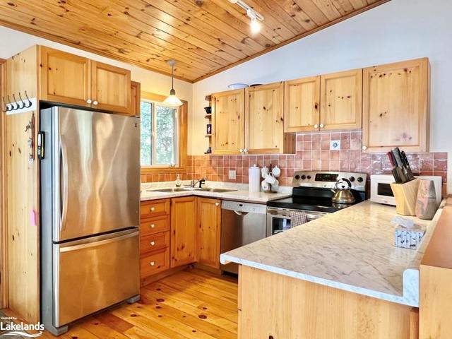 Kitchen with stainless steel appliances and... | Image 11