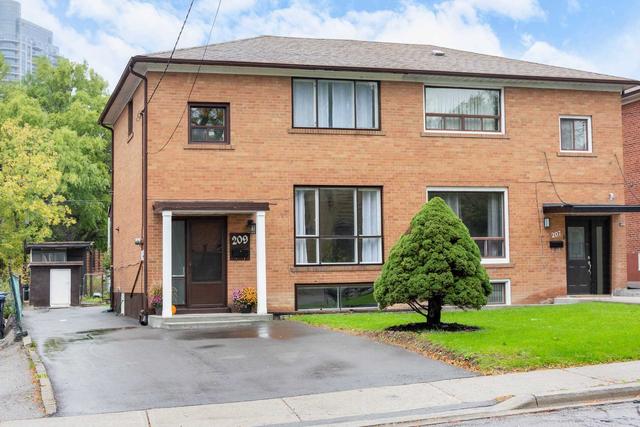 209 Habitant Dr, House semidetached with 3 bedrooms, 2 bathrooms and 3 parking in Toronto ON | Image 1