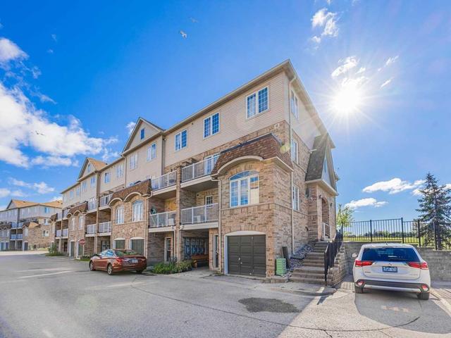 3 - 200 Mclevin Ave, Townhouse with 2 bedrooms, 1 bathrooms and 1 parking in Toronto ON | Image 1