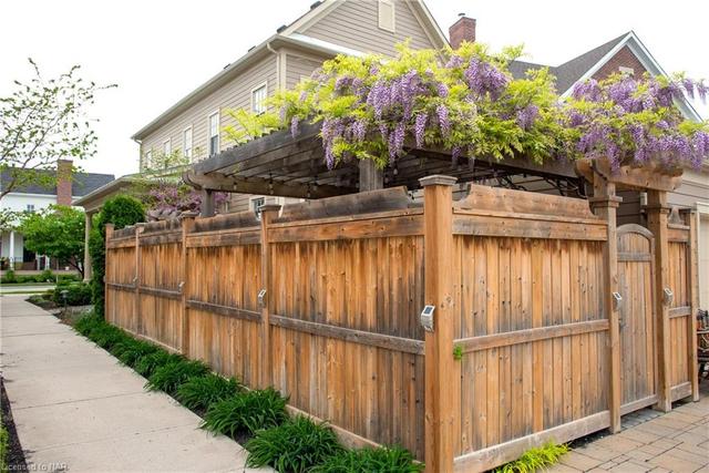 Fully fenced-in courtyard with two gates. | Image 24