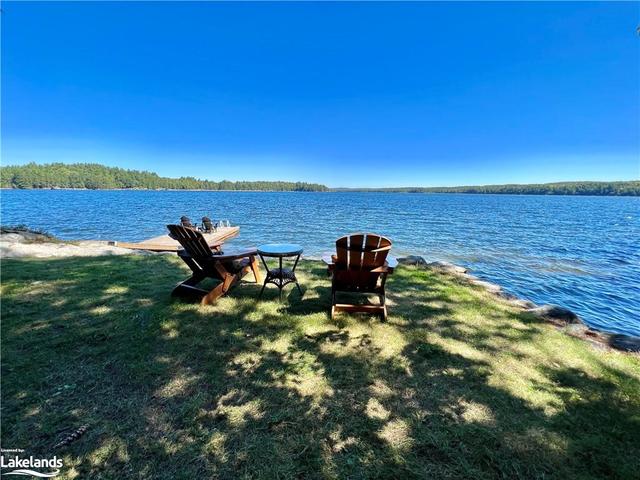 ... is perfectly situated on a  gorgeous and private Canadian Shield  point lot. | Image 5