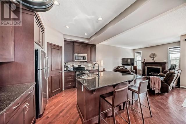 516 Panatella Square Nw, House semidetached with 3 bedrooms, 2 bathrooms and 2 parking in Calgary AB | Image 4