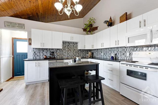 Modern kitchen with granite island | Image 13