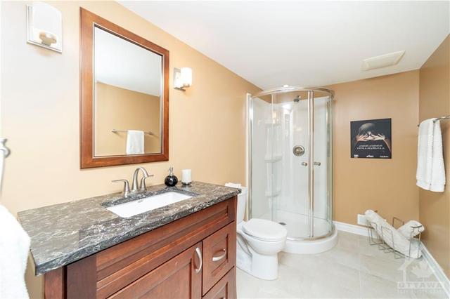 Another full bathroom in the basement for your overnight guests or after finishing your workout. | Image 26