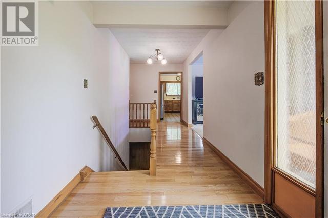 hallway leading to living room and kitchen | Image 5