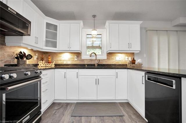 Dark Stainless KITCHENAID Gas Stove, matching Microwave Overhead Range and Walk-in Pantry | Image 7