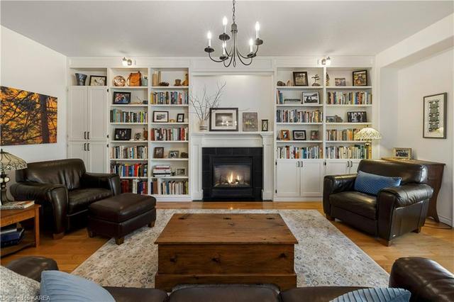 inviting family room with custom built bookshelves | Image 4