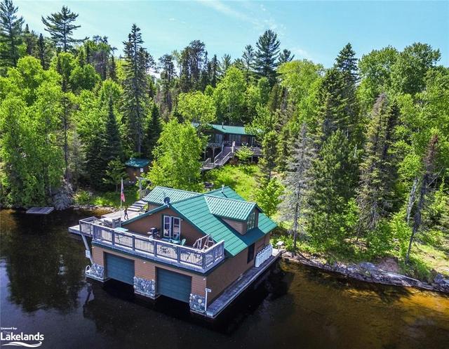 Aerial view of front of cottage and boathouse suite | Image 1