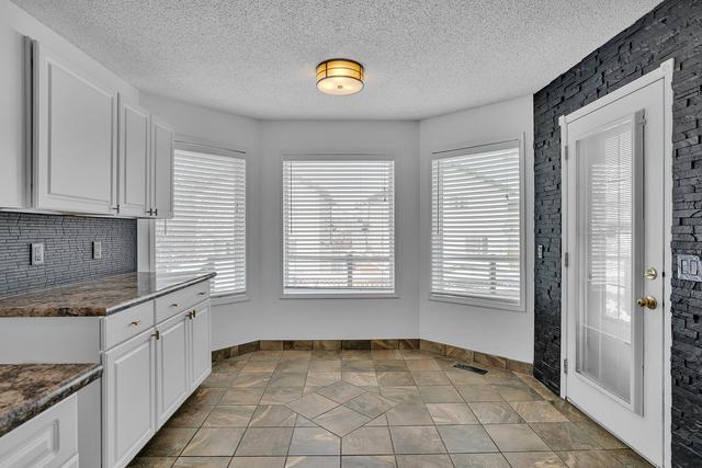 222 Douglas Ridge Circle Se, House detached with 3 bedrooms, 3 bathrooms and 4 parking in Calgary AB | Image 11
