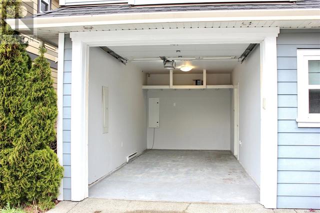 Extended garage with lots of room for your vehicle and storage! | Image 23