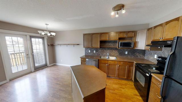 10306 70 Avenue, Home with 2 bedrooms, 2 bathrooms and null parking in Grande Prairie AB | Image 4