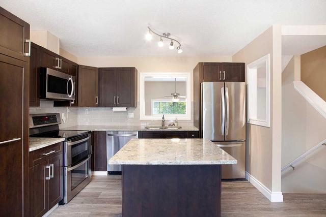 71 Cougar Ridge Mews Sw, Home with 2 bedrooms, 1 bathrooms and 2 parking in Calgary AB | Image 10