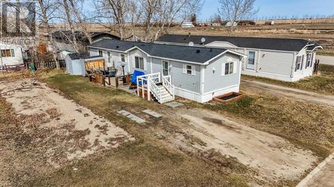 103 Glasgow Street, Home with 3 bedrooms, 2 bathrooms and 2 parking in Foothills County AB | Card Image