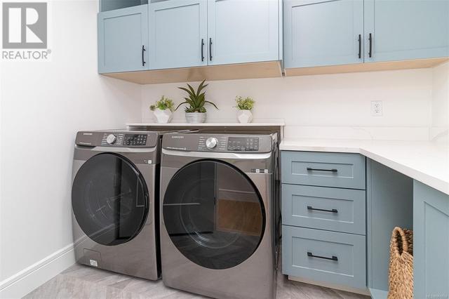 Full size Front loading washer and dryer upstairs of main residence | Image 43