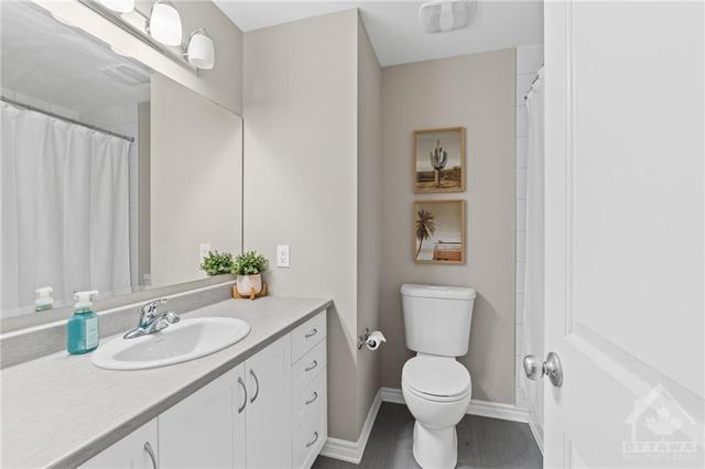 3rd floor- 4 piece bathroom with extra storage under built-in vanity. | Image 24