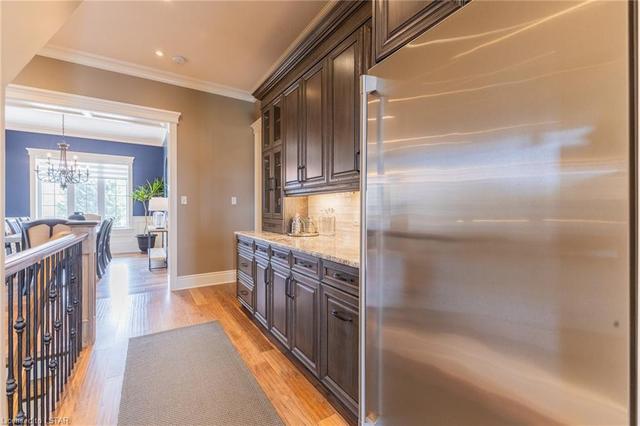 Butler's pantry with second Electrolux fridge, maple cabinets and granite counters | Image 13