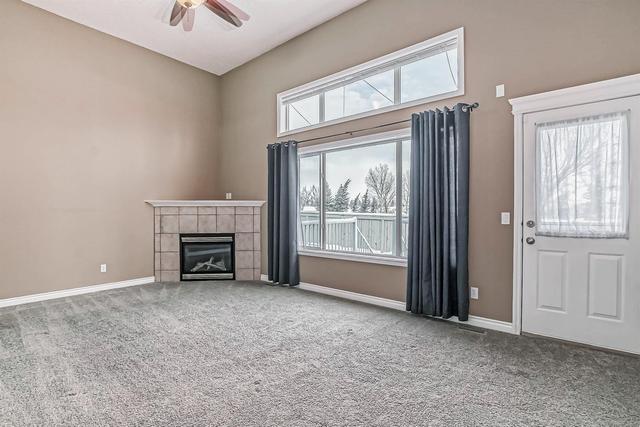 80 Crystal Shores Cove, Home with 3 bedrooms, 2 bathrooms and 2 parking in Calgary AB | Image 10