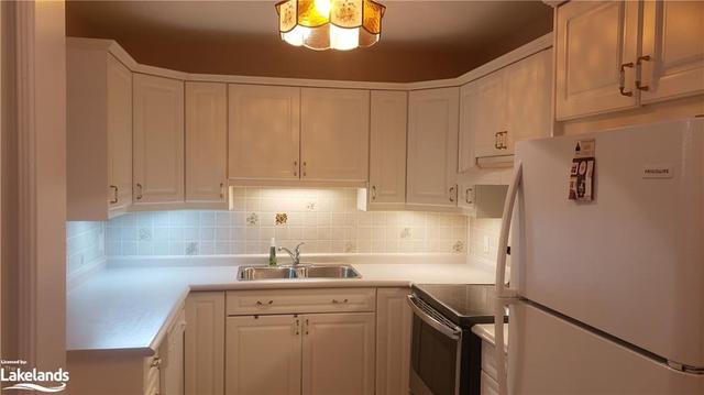 Bright white kitchen with undercounter lighting and back splash | Image 18