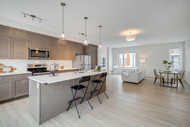 129 Shawnee Common Sw, Home with 3 bedrooms, 2 bathrooms and 2 parking in Calgary AB | Image 11