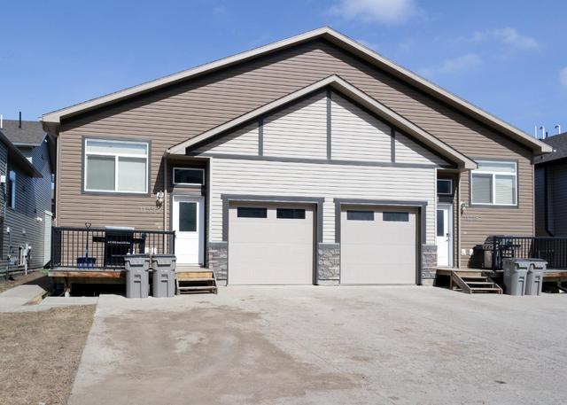 11322 105 Avenue, Home with 4 bedrooms, 4 bathrooms and 4 parking in Grande Prairie AB | Image 11
