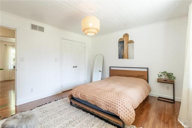 Master bedroom other angle, over hardwood flooring like the rest of the main level bedrooms. | Image 22
