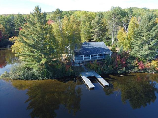 1396 Kamaniskeg Lake Road, House detached with 2 bedrooms, 2 bathrooms and 4 parking in Hastings Highlands ON | Card Image