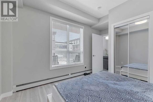 205, - 383 Smith Street Nw, Condo with 2 bedrooms, 2 bathrooms and 1 parking in Calgary AB | Image 18