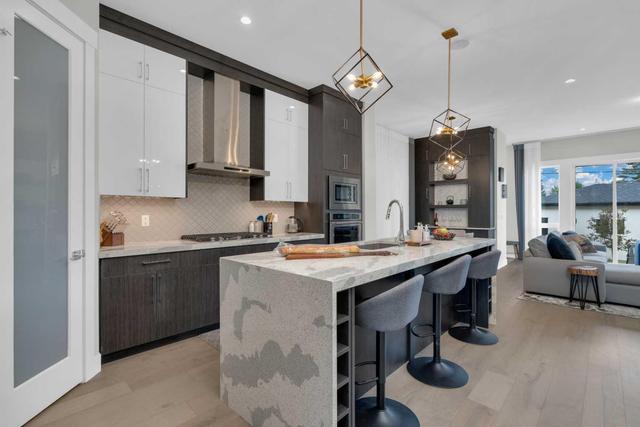 4126 7 Avenue Sw, Home with 4 bedrooms, 3 bathrooms and 2 parking in Calgary AB | Image 1