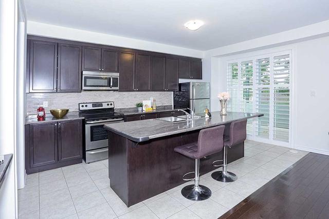 94 Heron Park Pl, House attached with 3 bedrooms, 3 bathrooms and 3 parking in Toronto ON | Image 3