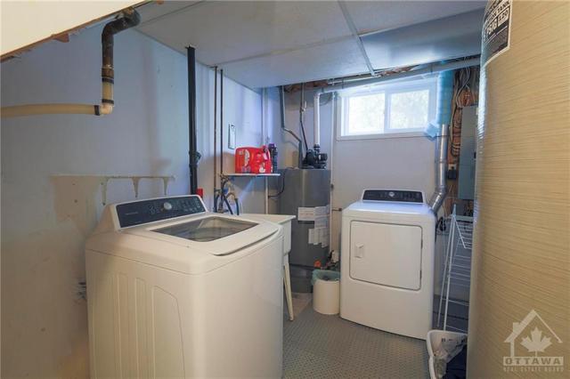Laundry room is tucked out of the way | Image 24
