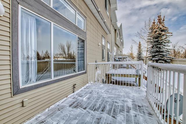 80 Crystal Shores Cove, Home with 3 bedrooms, 2 bathrooms and 2 parking in Calgary AB | Image 27