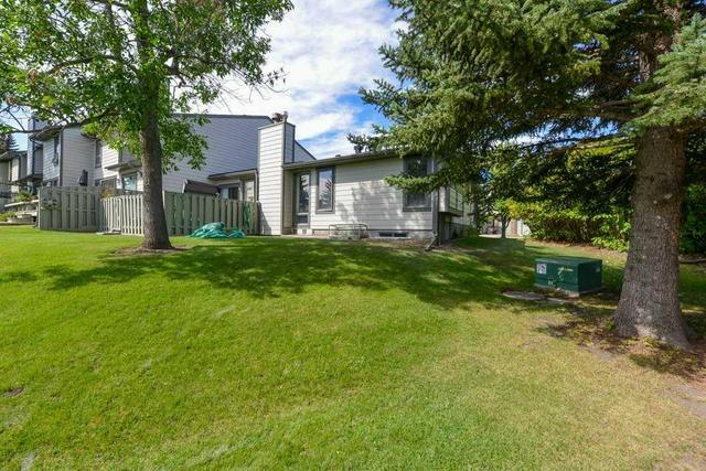 18 - 185 Woodridge Drive Sw, Home with 3 bedrooms, 3 bathrooms and 4 parking in Calgary AB | Image 3