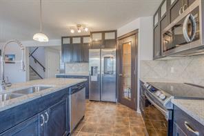 122 Channelside Cove Sw, House detached with 7 bedrooms, 3 bathrooms and 4 parking in Calgary AB | Image 1