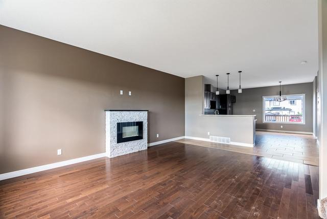 385 Collicott Drive, Home with 4 bedrooms, 3 bathrooms and 3 parking in Wood Buffalo AB | Image 4