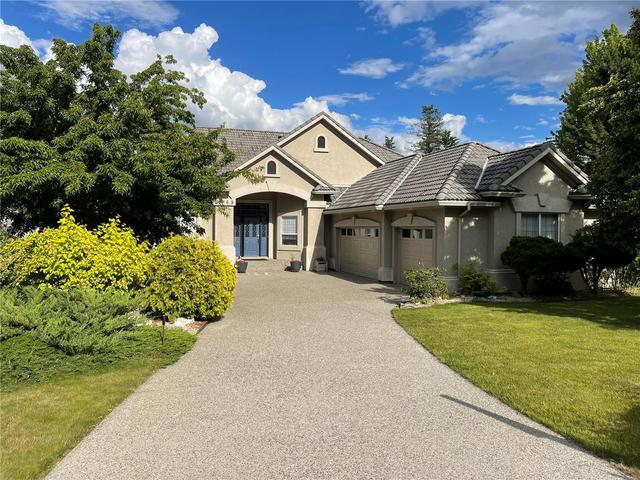 2069 Capistrano Drive, House detached with 4 bedrooms, 3 bathrooms and 6 parking in Kelowna BC | Card Image