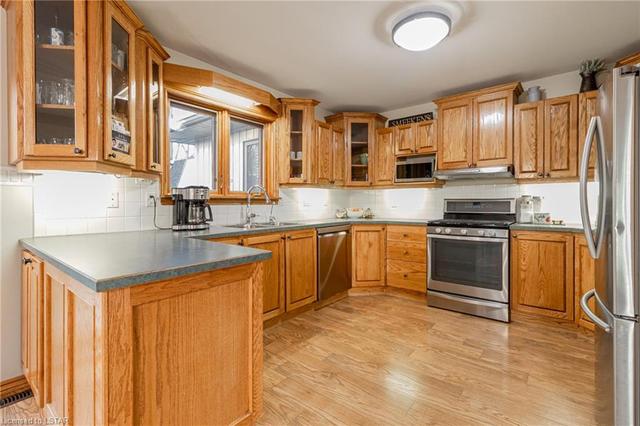 Kitchen is fine as-is, but if you swap out those counters and get the doors painted white, you'll have a brand new looking kitchen with those slick updated appliances (again, all included)! | Image 20