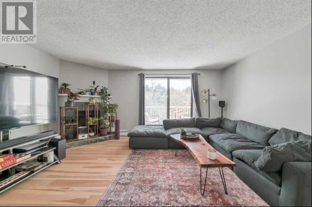 Winner! Steps off 17th Ave SW, large 2 bdrms, 2 full bath condo with low fees | Image 1