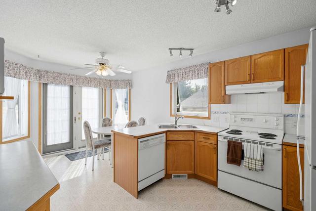 24 Woodside Park Nw, House detached with 3 bedrooms, 3 bathrooms and 2 parking in Airdrie AB | Image 9