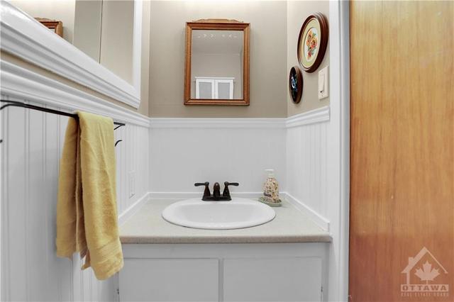small but efficient powder room on the main level | Image 16