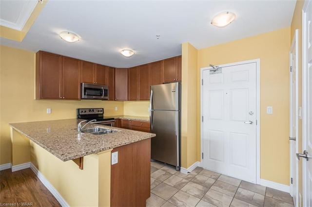 214 - 2 Colonial Drive, House attached with 2 bedrooms, 2 bathrooms and 2 parking in Guelph ON | Image 2