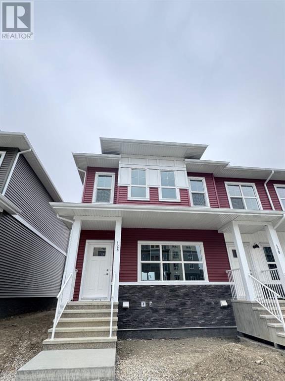 128 Merganser Drive W, House attached with 3 bedrooms, 2 bathrooms and 2 parking in Chestermere AB | Image 1